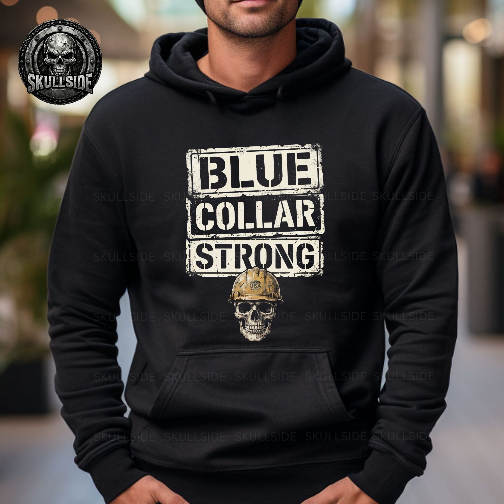 Black hoodie with 'Blue Collar Strong' text and skull graphic worn by a person.